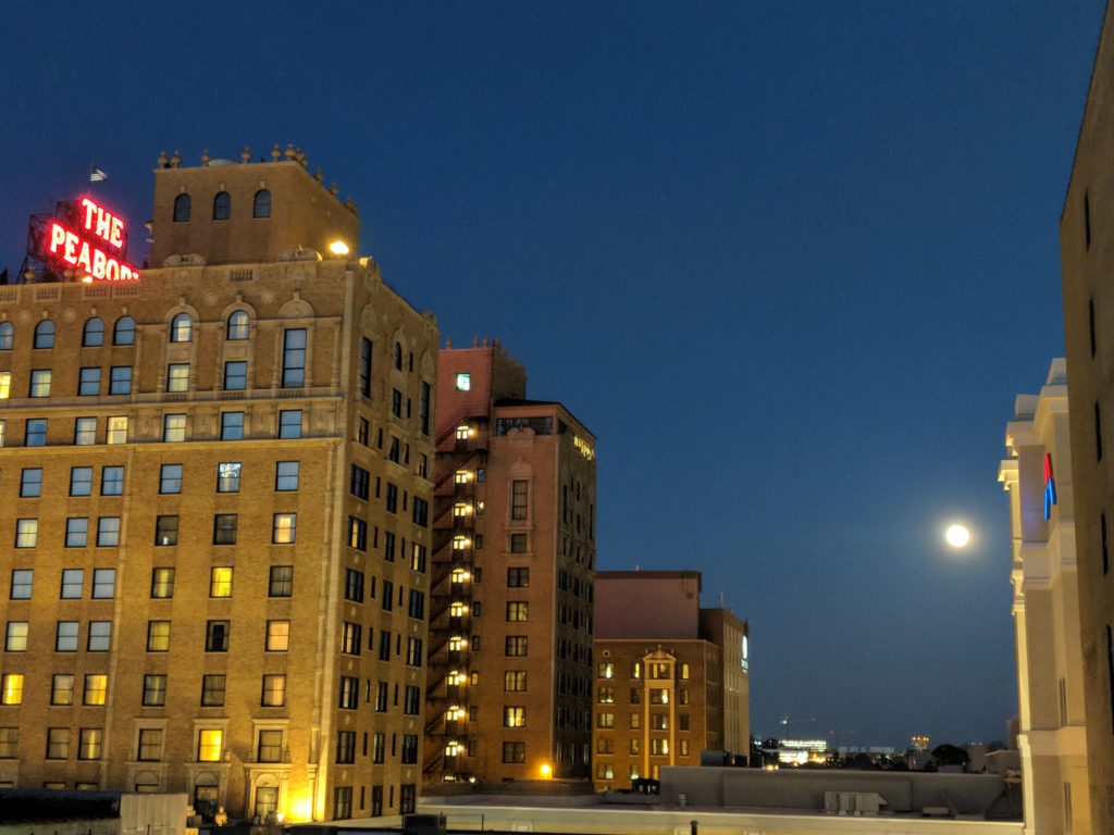 Peabody Hotel with full moon rising to the right